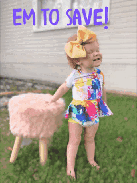 a little girl standing next to a pink stool with the words em to save