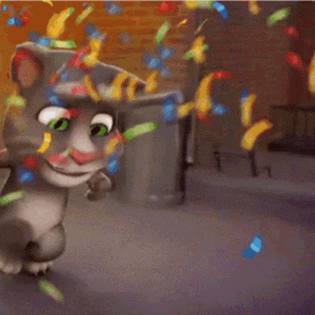 a cat with green eyes is holding a piece of paper in front of confetti