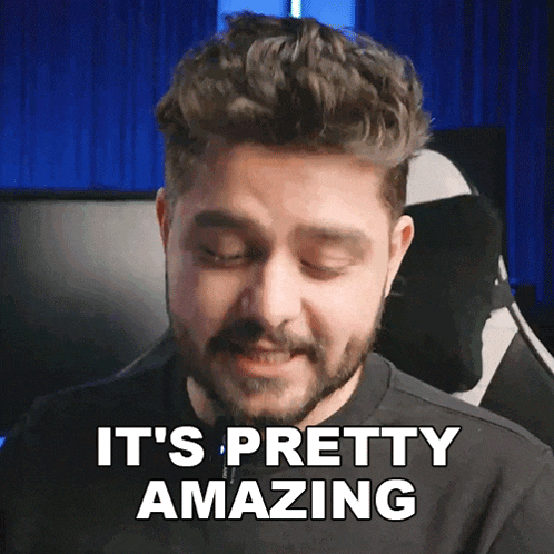 a man with a beard says it 's pretty amazing in front of a blue background