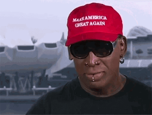 a man wearing a make america great again hat