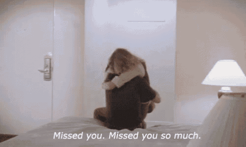 a man and woman hugging on a bed with the words " missed you missed you so much "