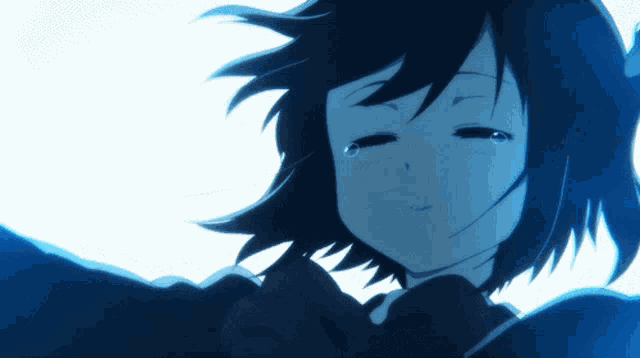 a close up of a girl 's face with a tear running down her cheek