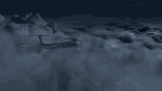 a space ship is flying through a cloudy sky