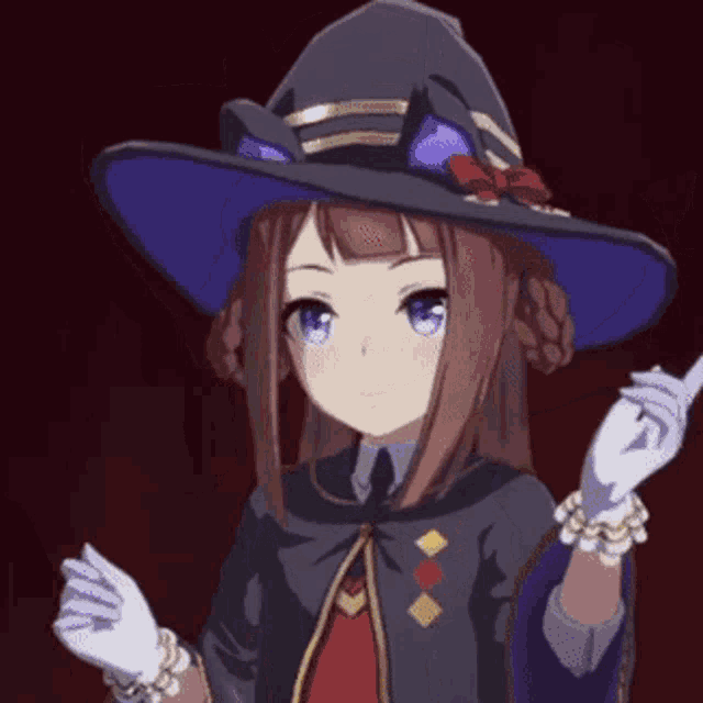 a girl in a witch costume is holding a wand .
