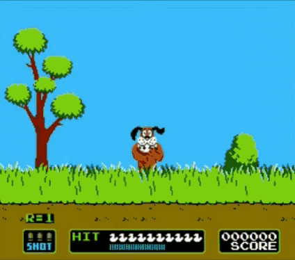 a video game screen shows a dog in the grass and a tree