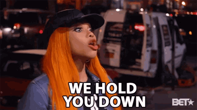 a woman says we hold you down in front of a white van