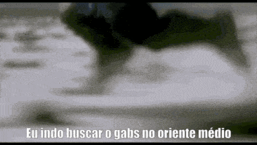 a black and white photo of a person writing on a piece of paper with the caption `` eu indo buscar o gabs no oriente medio ''