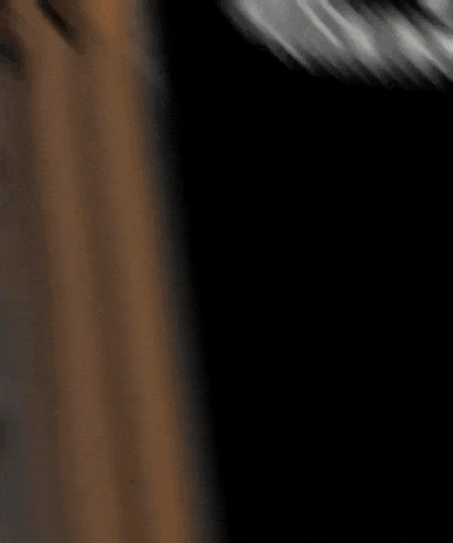 a blurred image of a person 's face with a blue shirt on
