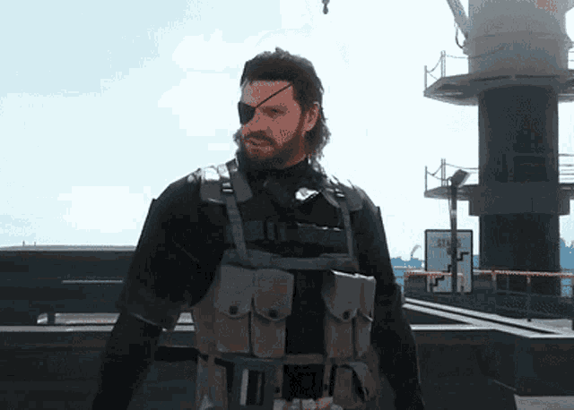 a man with a beard and an eye patch stands in front of a sign that says " emergency "