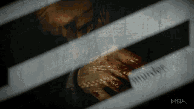 a blurred image of a person behind bars with the word murder on the bottom right