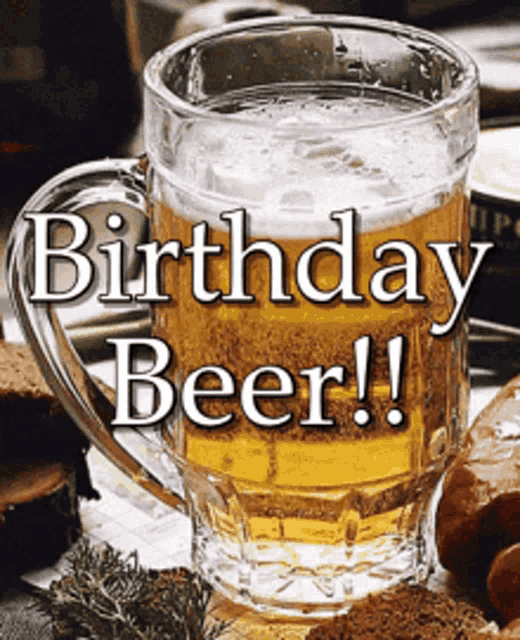 a glass of beer with the words birthday beer written above it