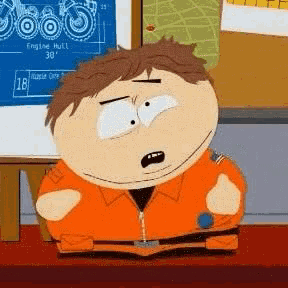 a cartoon character from south park is sitting at a desk