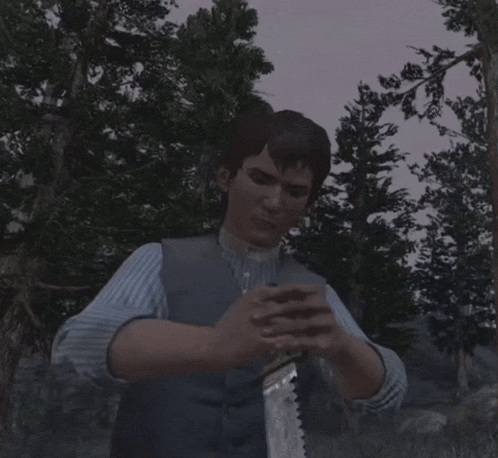 a man in a blue and white striped shirt is sitting in the woods