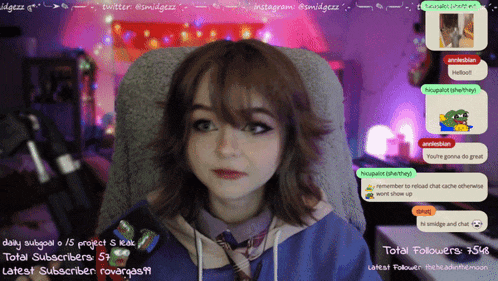 a girl is sitting in front of a screen that says ' total followers ' at the top