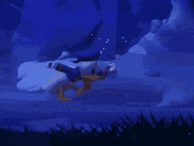 a cartoon character in a blue hat is laying on the ground