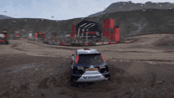 a video game shows a car driving through a dirt field