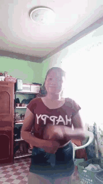 a woman wearing a shirt that says yttah is dancing