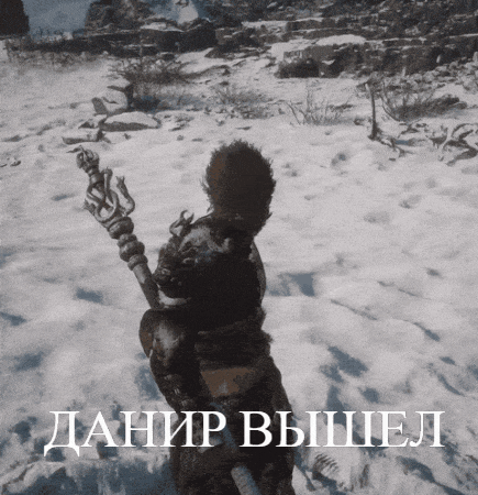 a video game character is standing in the snow with a foreign language written below him