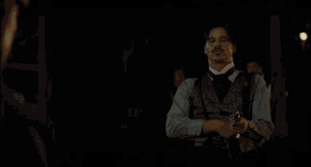 a man holding a gun with the words i have two guns below him