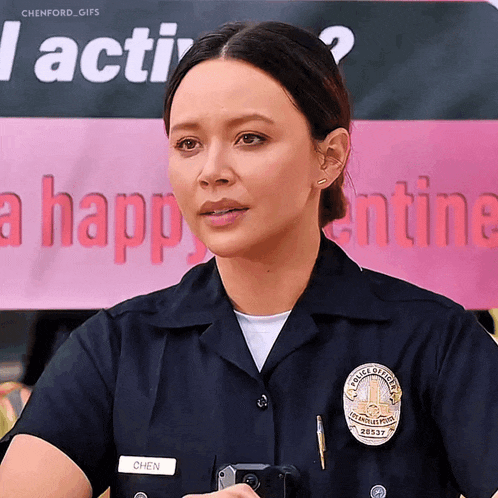 a woman in a police uniform has the name chen on her badge