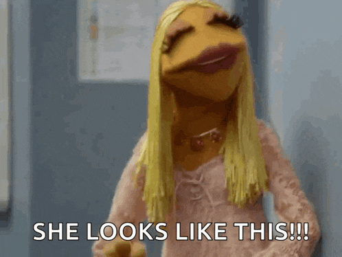 a muppet says she looks like this in a pink dress