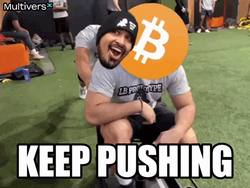 a man in a lb prototype shirt is being pushed by another man with a bitcoin symbol on his head