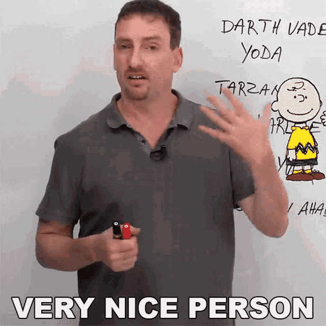 a man is holding a lighter in front of a whiteboard that says darth vader yoda tarzan and charlie brown