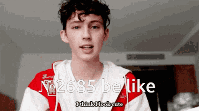 a young man in a red and white shirt with the number 6685 on it