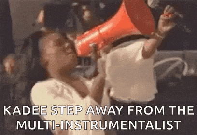 a person is holding a megaphone in their mouth and shouting into it .
