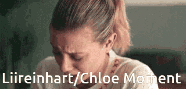 a woman is crying with the words liireinhart / chloe moment below her