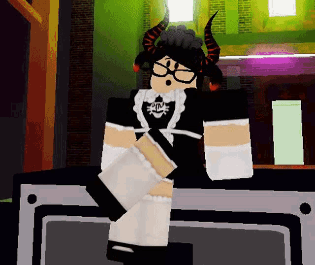 a minecraft character with horns and glasses is sitting on a table