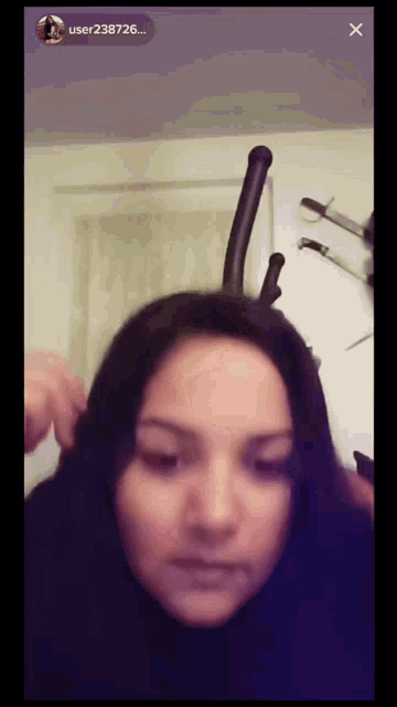 a woman 's face is shown on a screen with the username user238726 on the bottom
