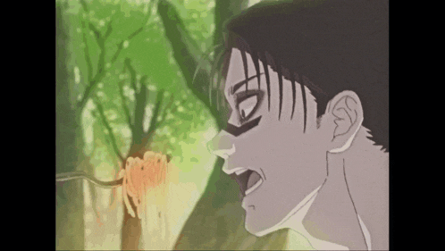 a man is eating spaghetti with a fork in a forest