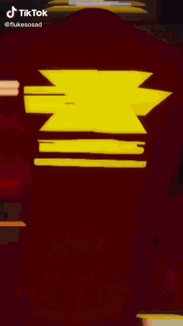 a blurred image of a person 's face with a tiktok logo in the corner