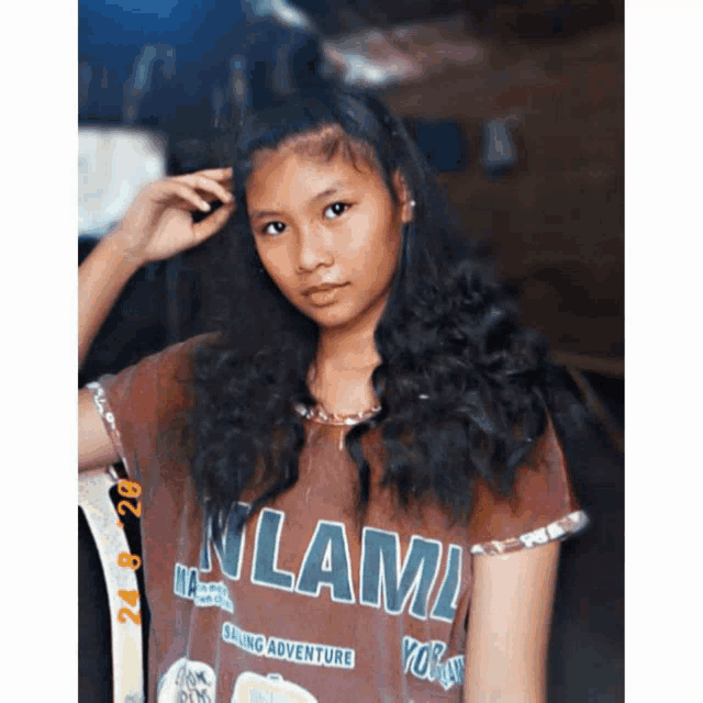 a girl is wearing a shirt that says miami