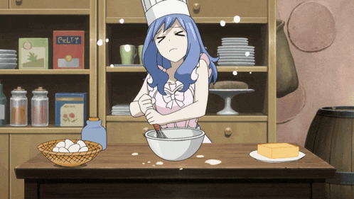a girl in a chef 's hat is mixing eggs in a bowl