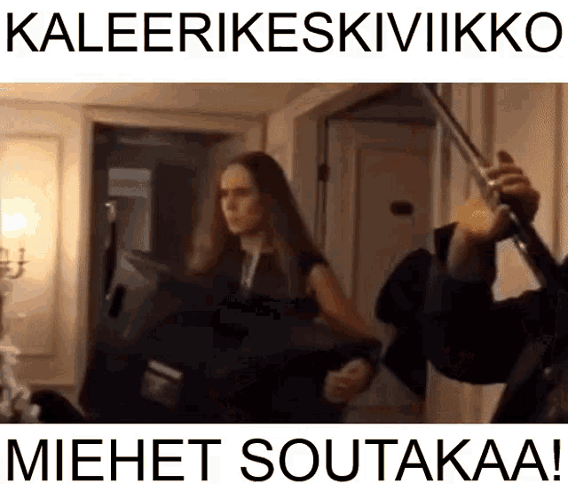 a picture of a woman holding an umbrella with the words kaleerikeskivikko written on it