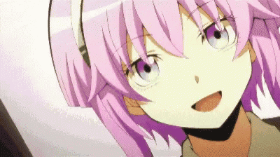 a close up of a girl with purple hair and blue eyes .