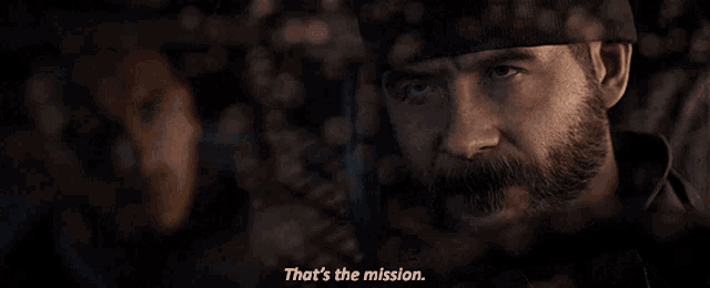 a man with a beard says " that 's the mission " in a dark room