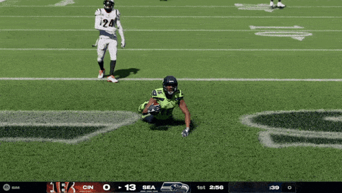 a football player with the number 16 on his jersey is kneeling down