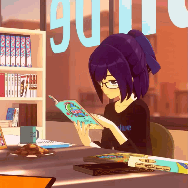 a girl is reading a book while wearing a shirt that says live