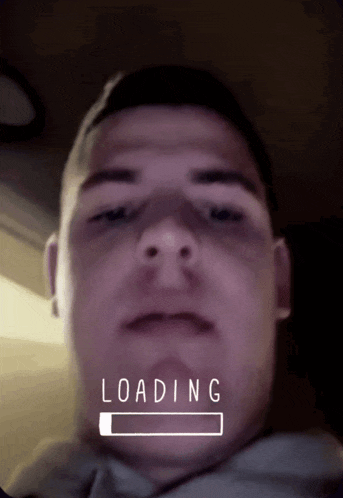 a man 's face is being loaded with a loading bar