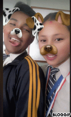 a boy and a girl with dog ears on their faces in a bloggif photo