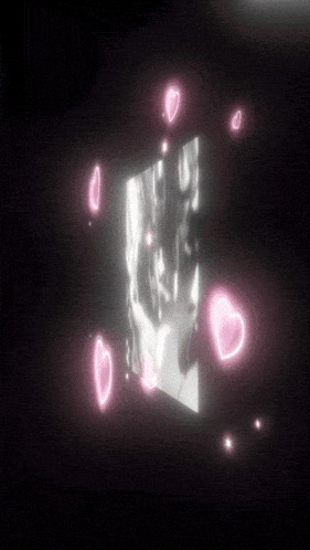 a black and white photo with pink hearts surrounding it