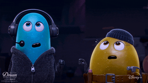 a blue cartoon character and a yellow cartoon character from dream productions are standing next to each other
