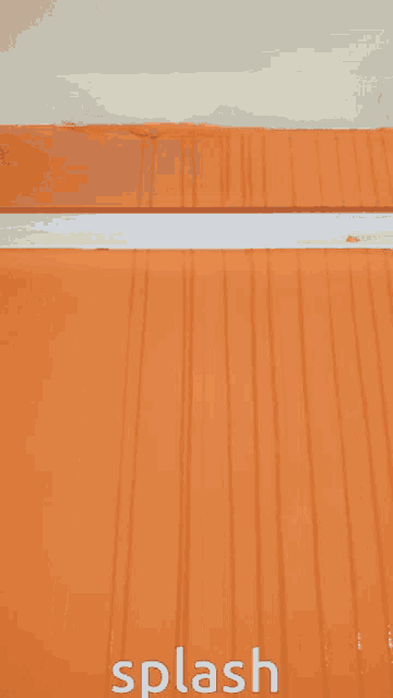 a picture of an orange wall with the word splash below it