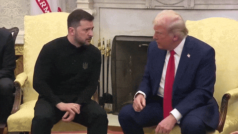 two men are sitting on a couch with a flag that says iran