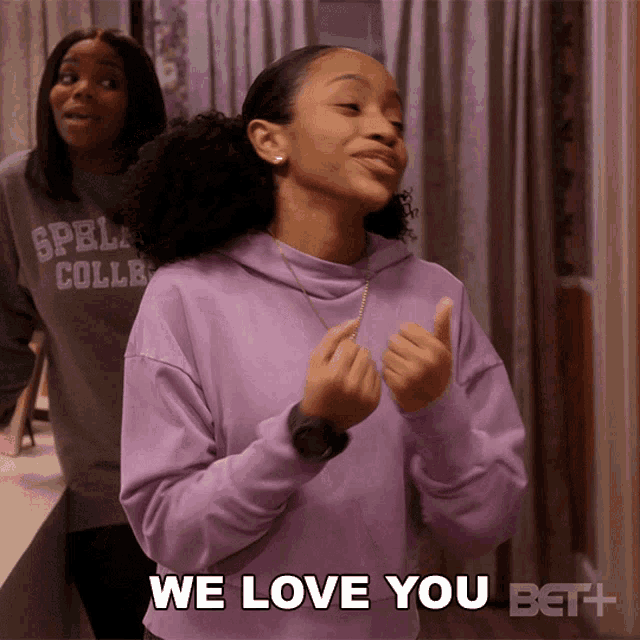 a girl in a purple sweatshirt says we love you bet
