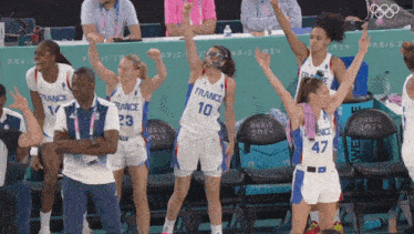 a group of basketball players wearing france uniforms