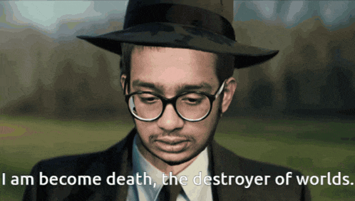 a man wearing glasses and a hat with the words i am become death the destroyer of worlds